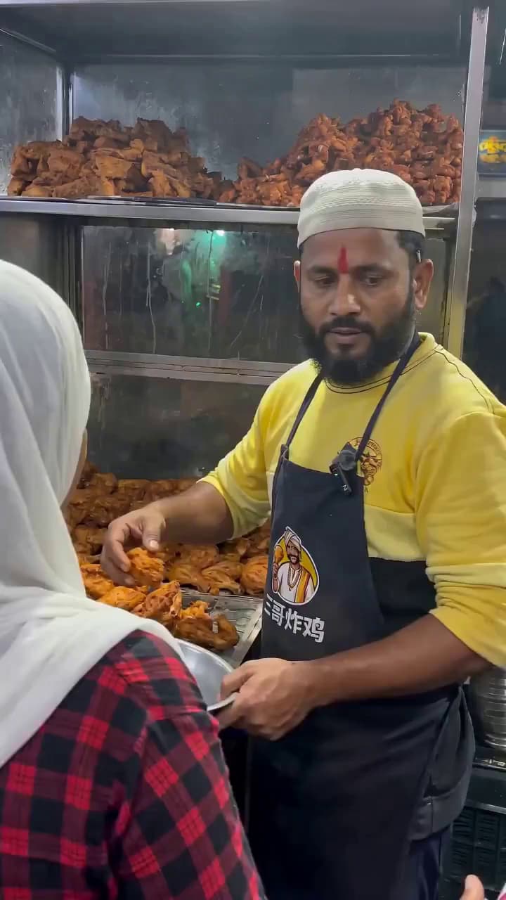 Chicken Shop Boss Handing Out Fried Chicken