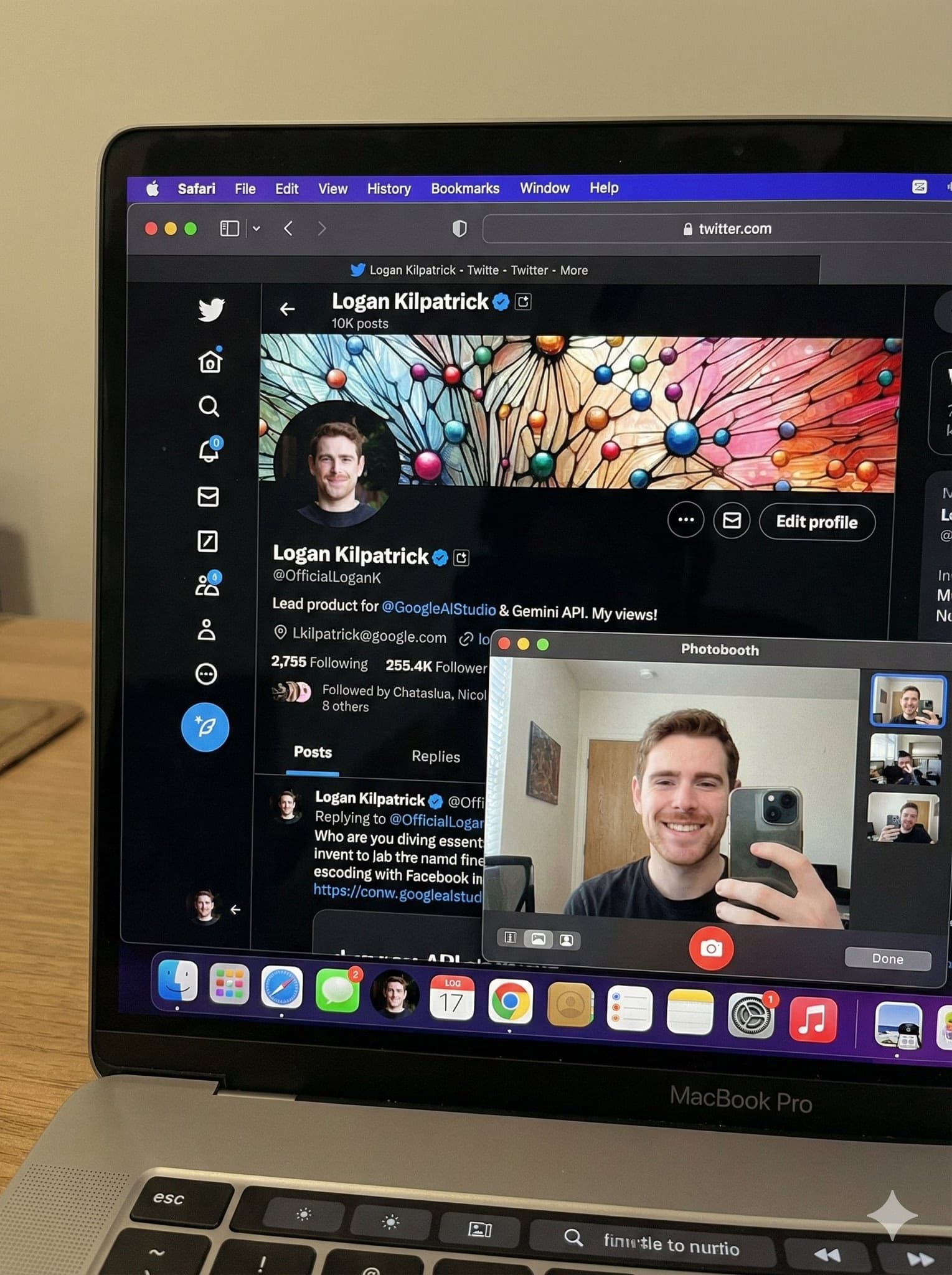 MacBook Pro with Safari and Photo Booth selfie