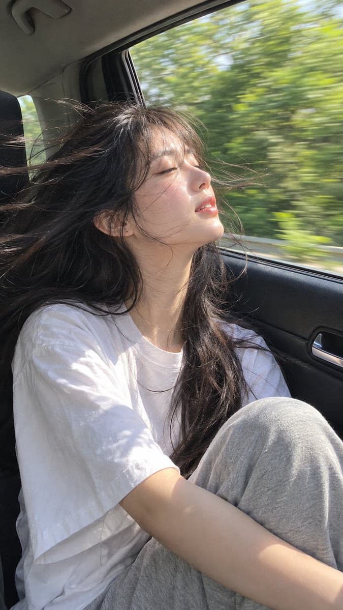 Sunlit Car Ride Portrait of Young Woman