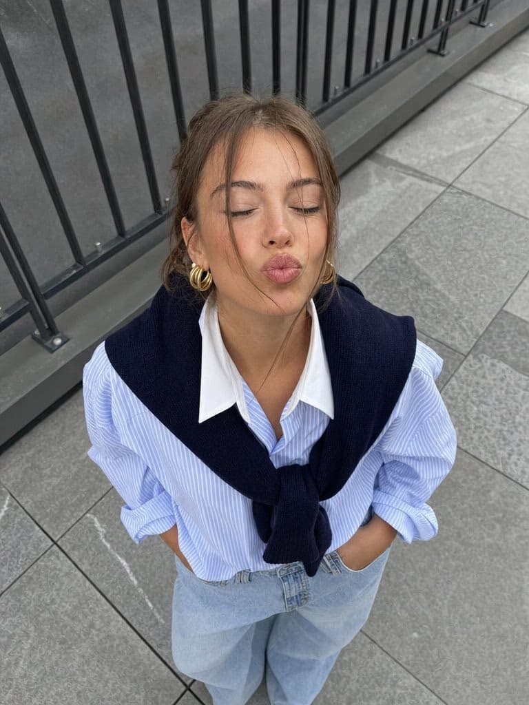 High-Angle Street-Style Portrait with Soft Pout