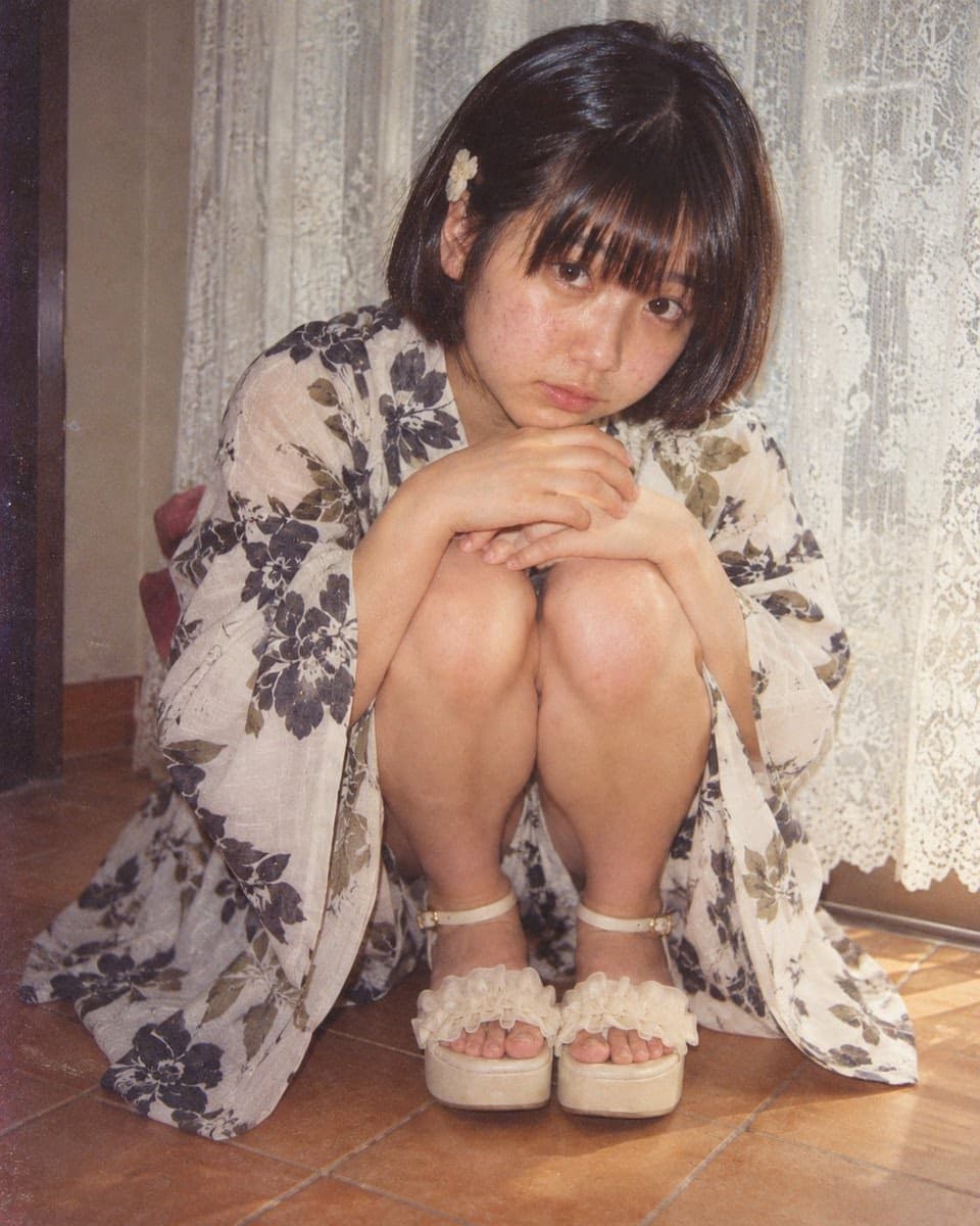 Retro Showa-era portrait of seated woman in kimono