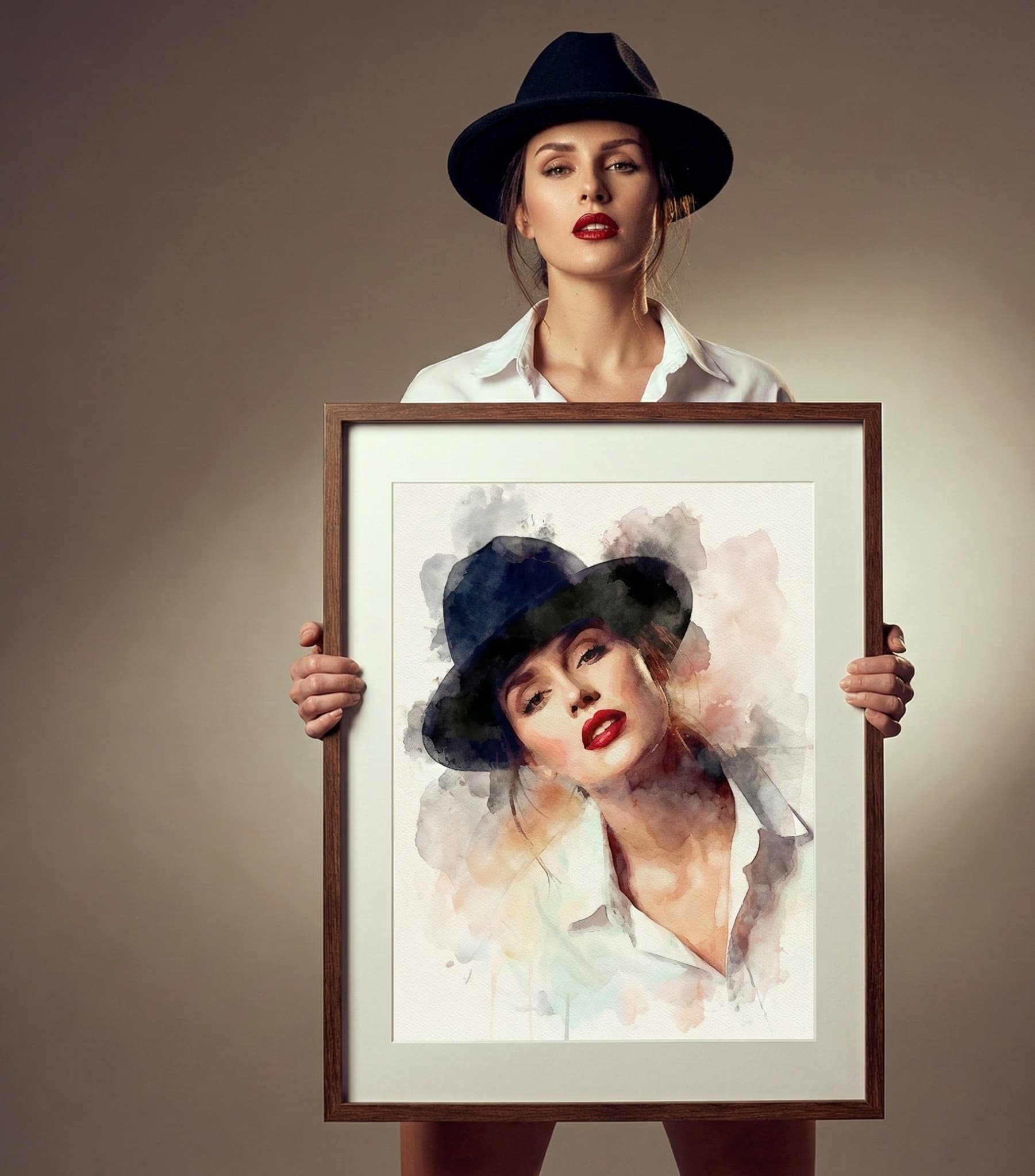 Woman holding watercolor portrait in studio